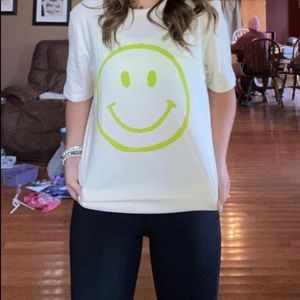 S/M, and L/XL available. Beige and Green smiley shirt